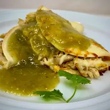 A quesadilla drowned in salsa verde